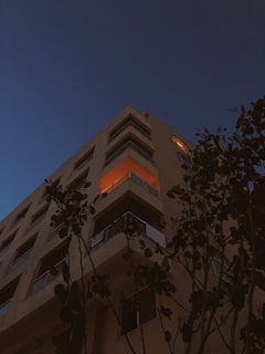 City view from a high-rise apartment balcony during twilight.