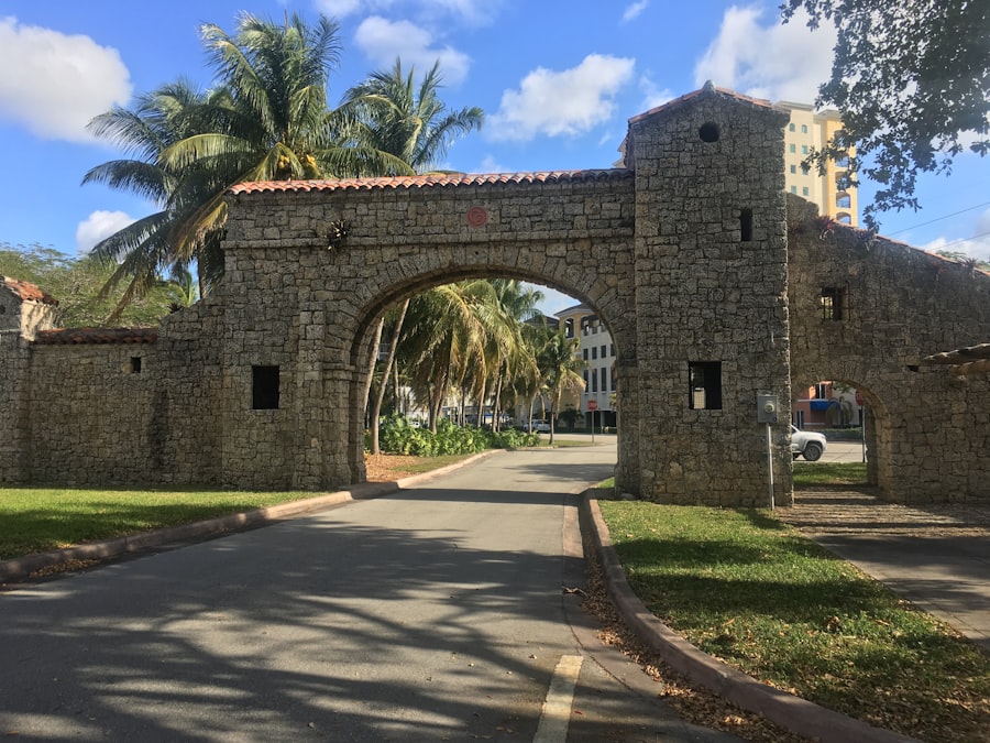 Coral Gables Mediterranean-style stone entrance with palms