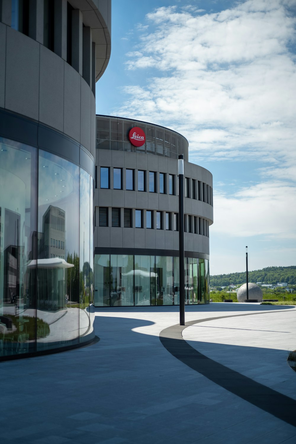 a round building with a red sign on the side of it