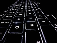 closeup photo of black and white Apple keyboard keys