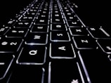 closeup photo of black and white Apple keyboard keys