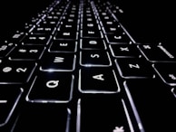 closeup photo of black and white Apple keyboard keys