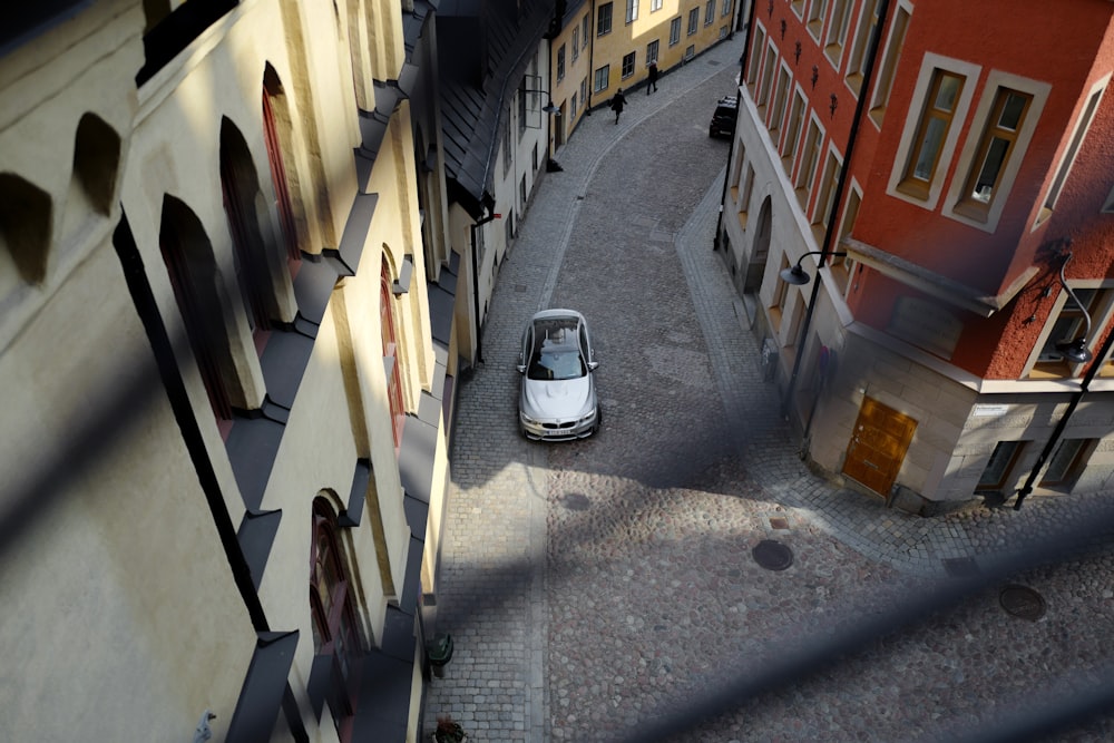 aerial view of grey vehicle beside building