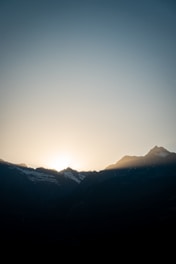 A peaceful sunrise scene over Yellowstone’s iconic geysers and rugged landscape.