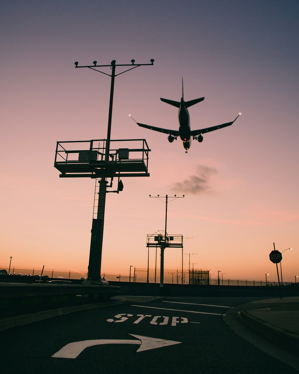 silhouette of airplane flying during daytime