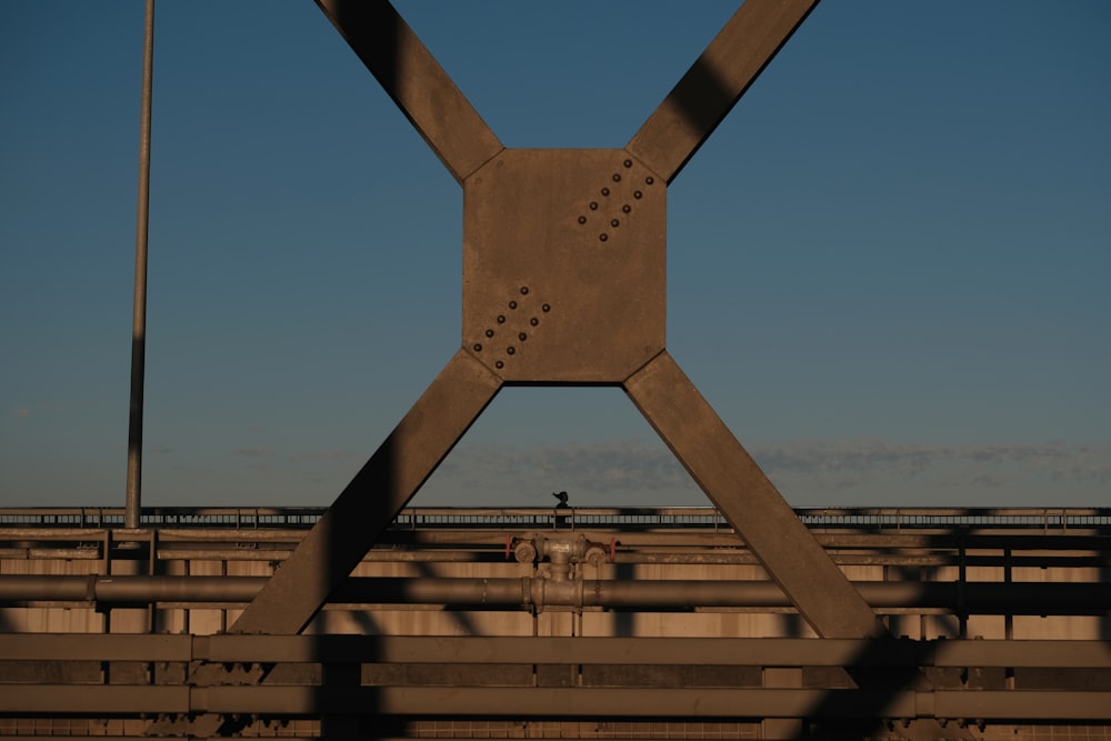 a large metal structure with a sky background