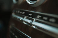 Photographer capturing detailed shots of a car’s interior for promotional material.