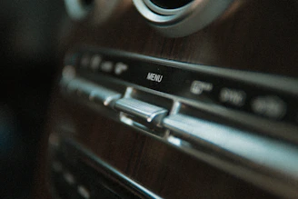 Photographer capturing detailed shots of a car’s interior for promotional material.