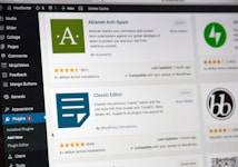 A computer screen displaying the WordPress dashboard with the Plugins section open. It shows various plugins such as Akismet Anti-Spam and Classic Editor with details like active installations, ratings, and update information. The left sidebar contains navigation options like Media, Comments, and Appearance.