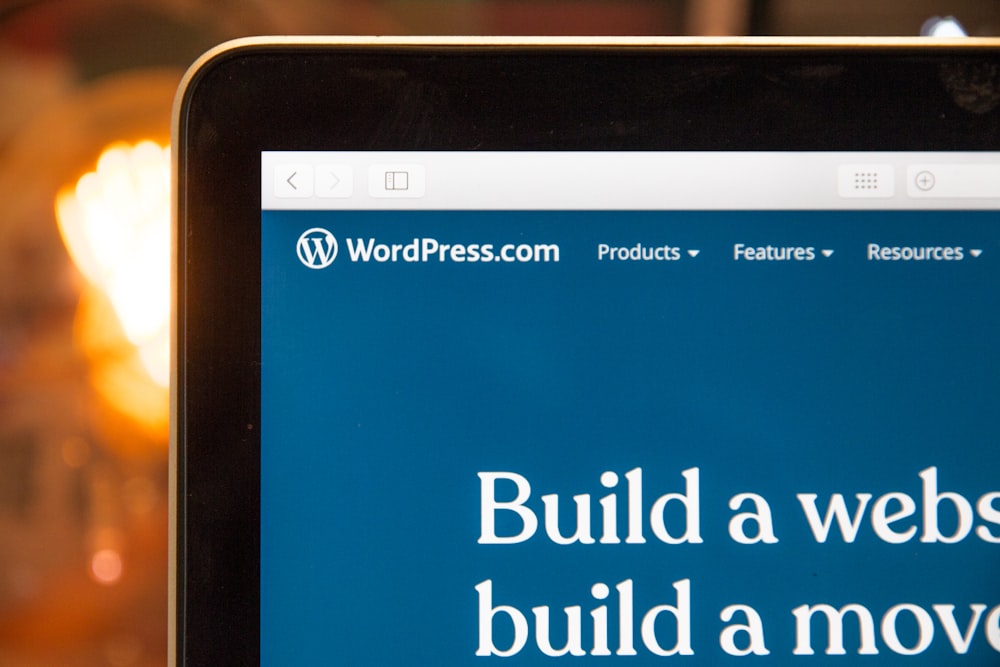 Website displayed on a desktop monitor in a working office