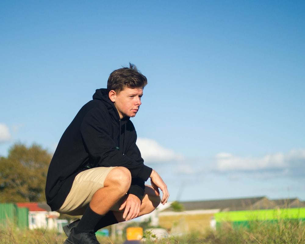 man wearing black pullover hoodie