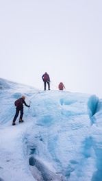 man climbing snow