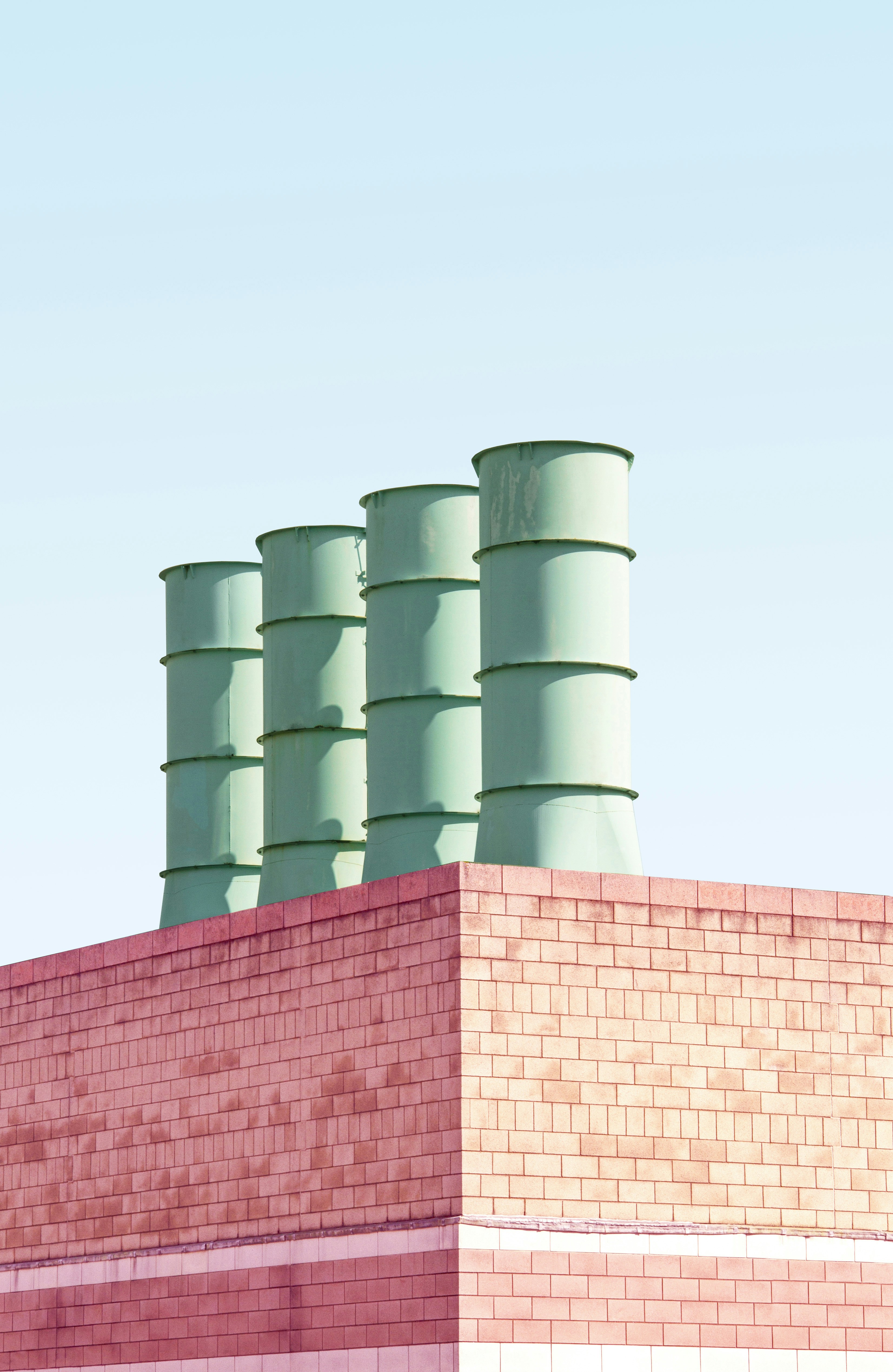 three green metal drums on roof