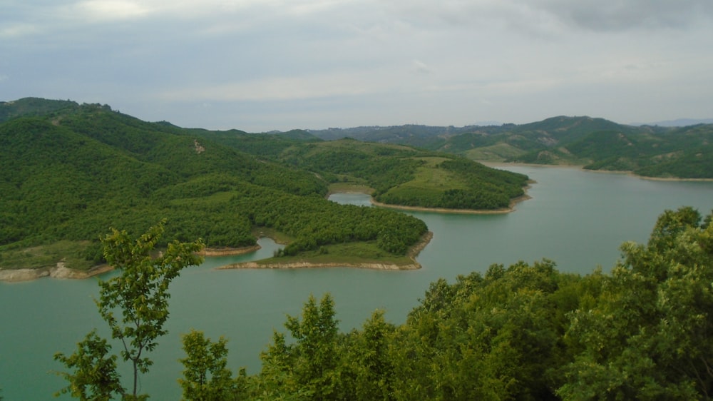 body of water near mountains