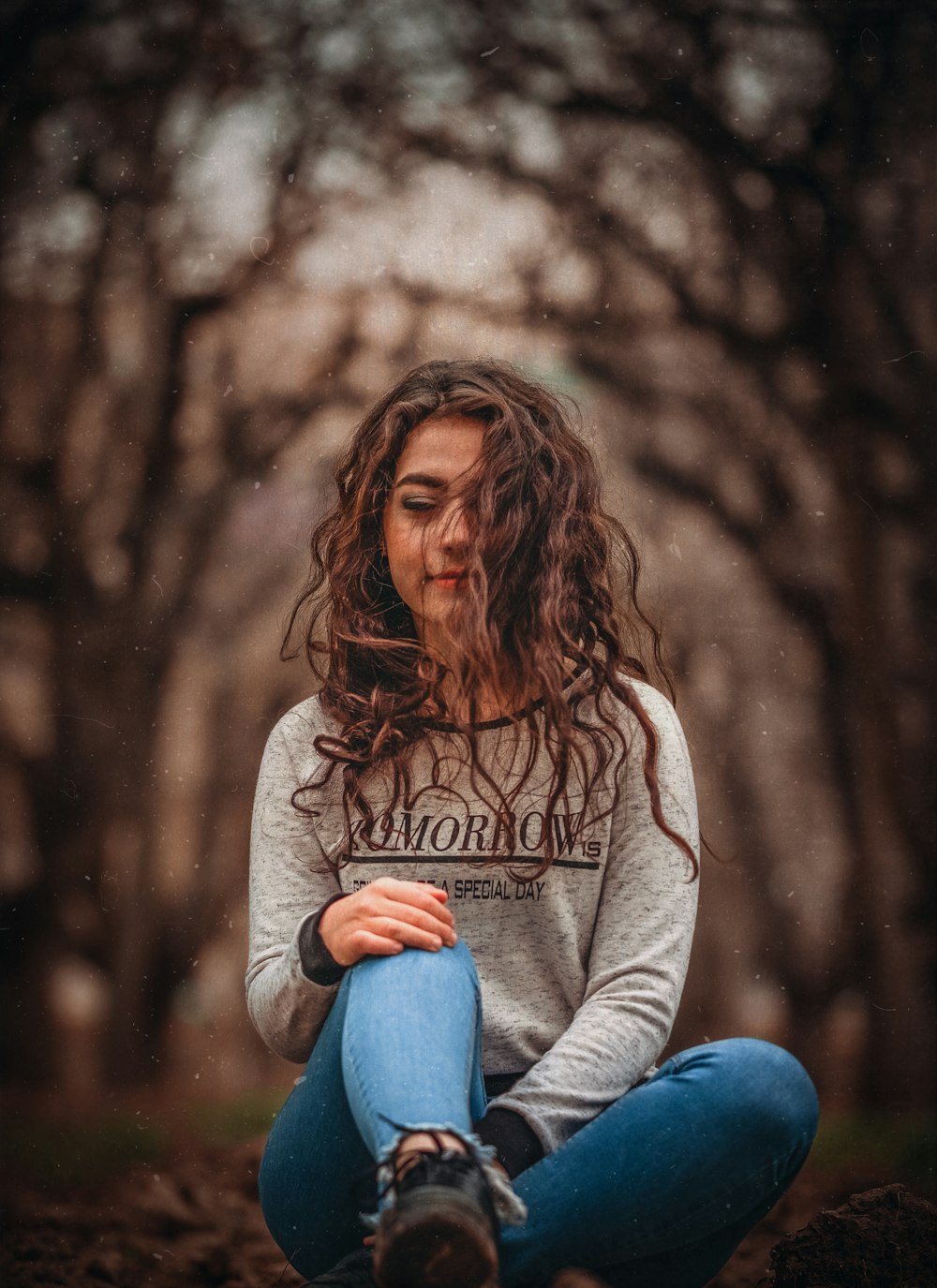 women sitting in front of trees during daytime close-up photography