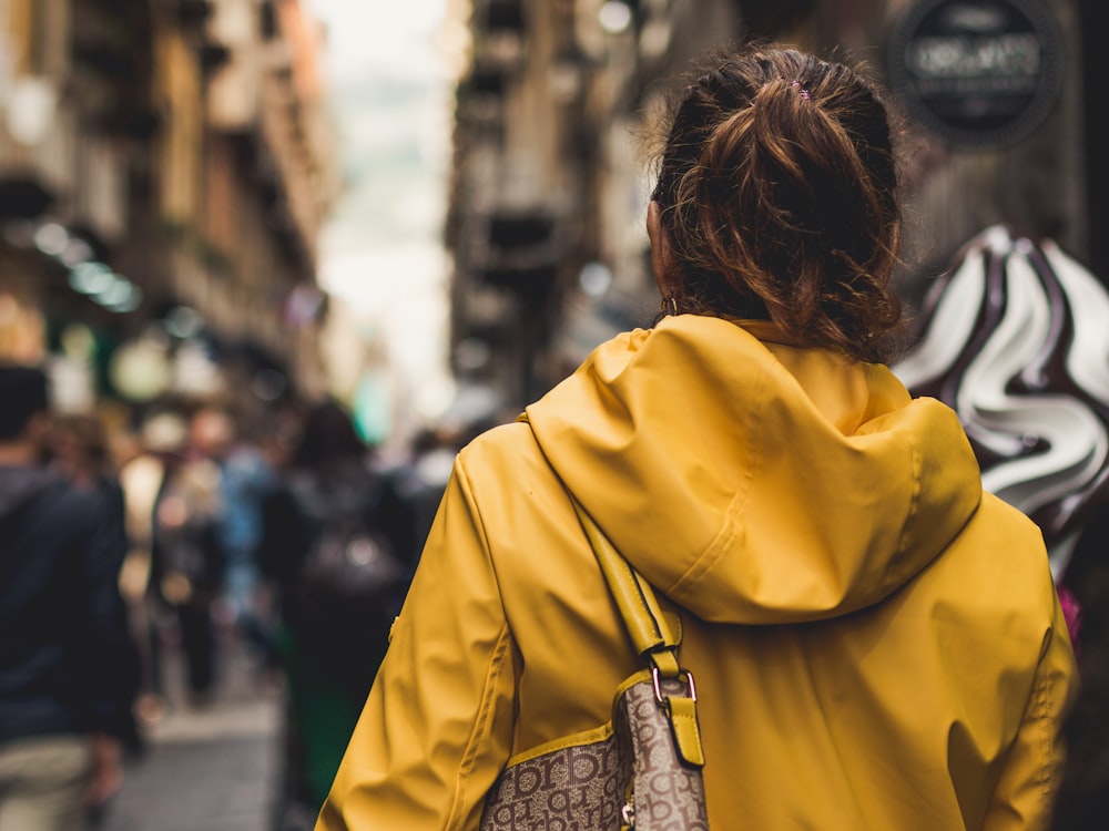 woman wearing jacket and bag