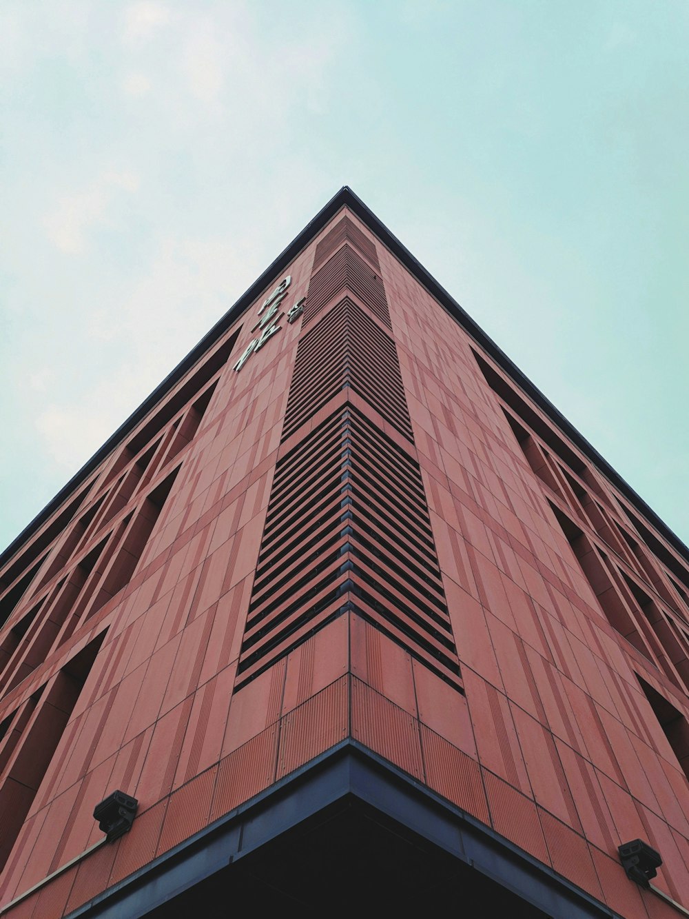 low-angle photography of brown building
