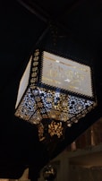A traditional lantern glowing warmly, symbolizing guidance and light in Islam.