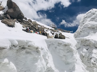 Snow-capped peaks of the Himalayas with colorful prayer flags fluttering in the breeze.