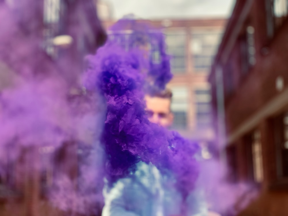 shallow focus photo of purple smoke