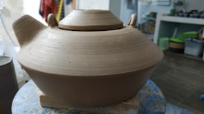 A sturdy, reusable fermenting vessel made of durable ceramic, ready for multiple fermentation cycles.