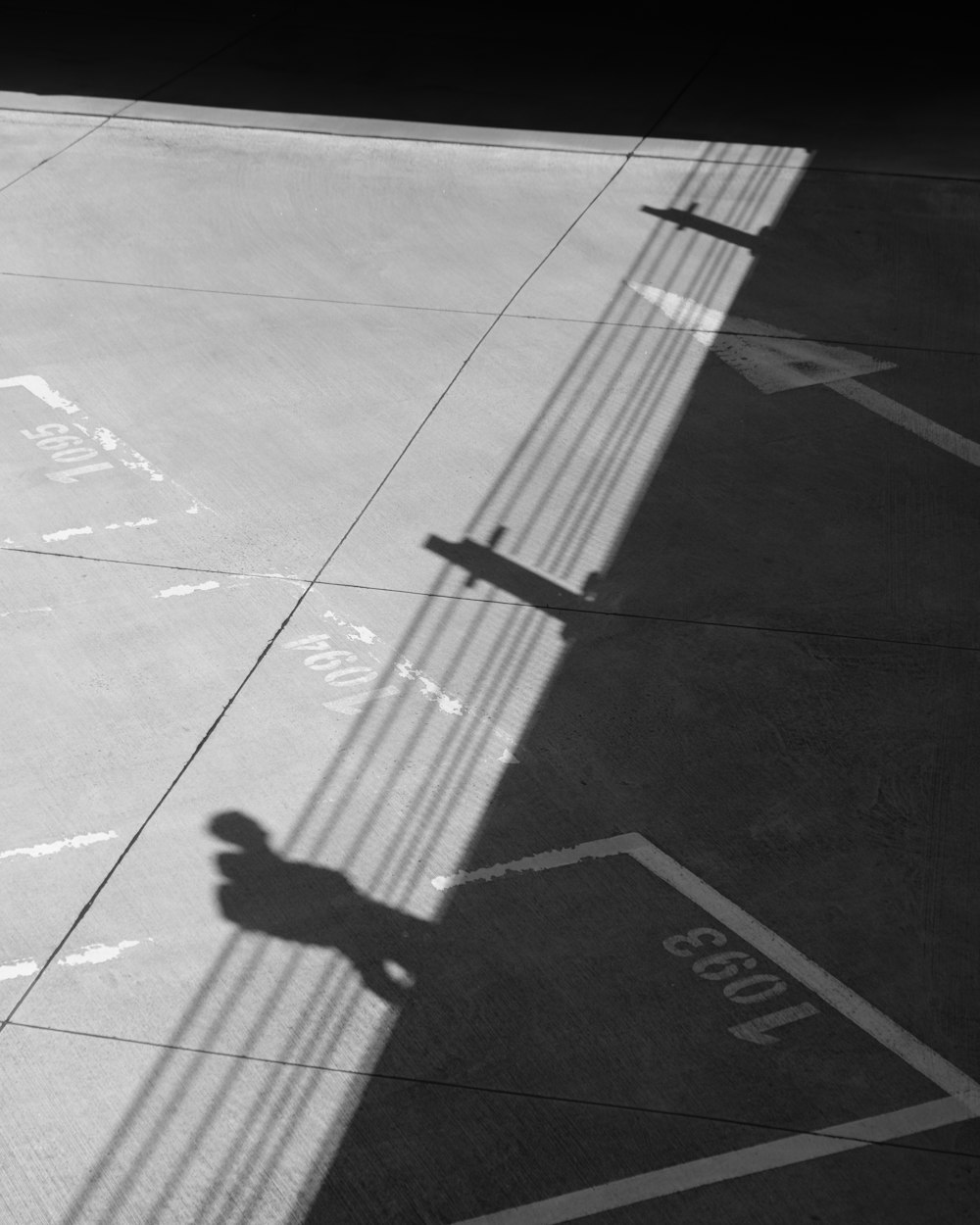 a shadow of a person riding a skateboard