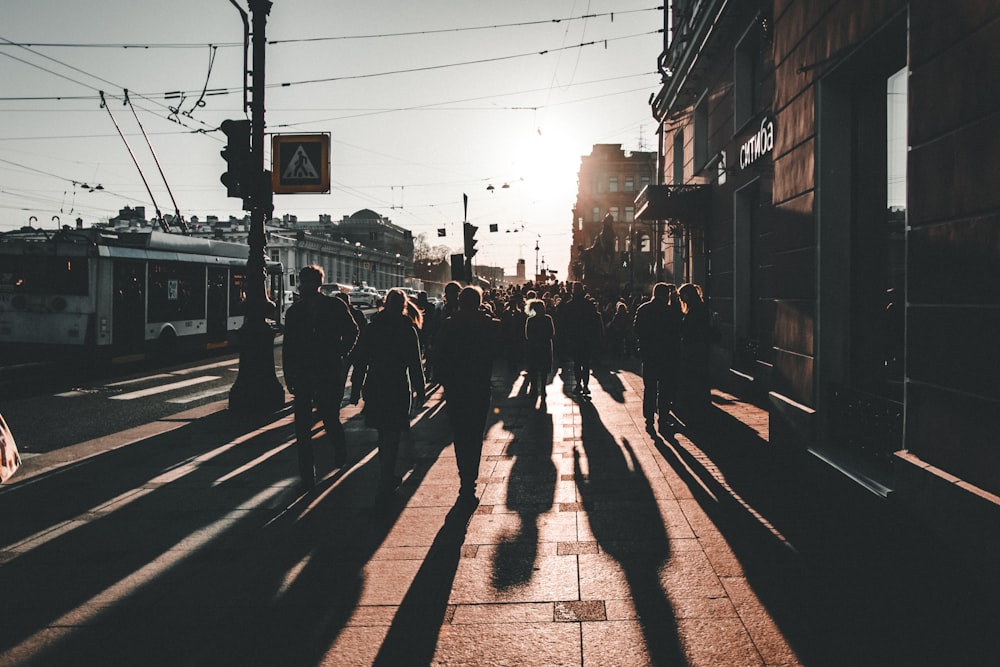 group of people walking on street during daytime