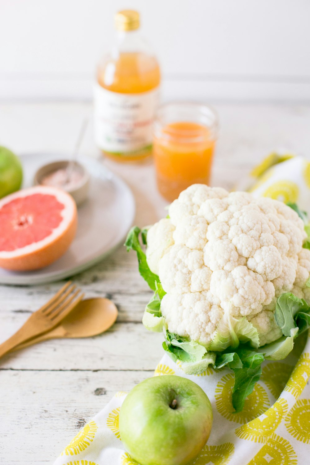 white cauliflower on white wooden surface