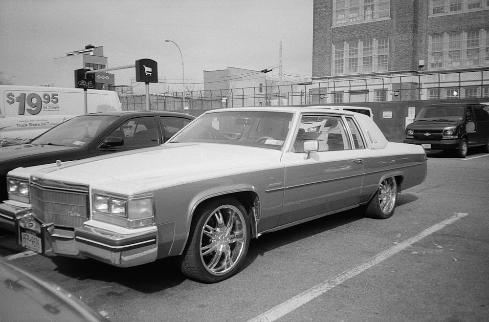 grayscale photography of Cadillac car