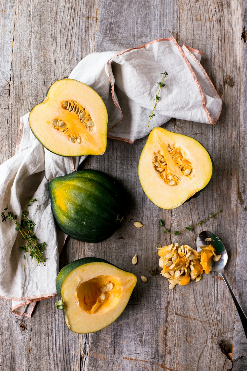 green and yellow squash on brown surface