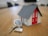white and red wooden house miniature on brown table