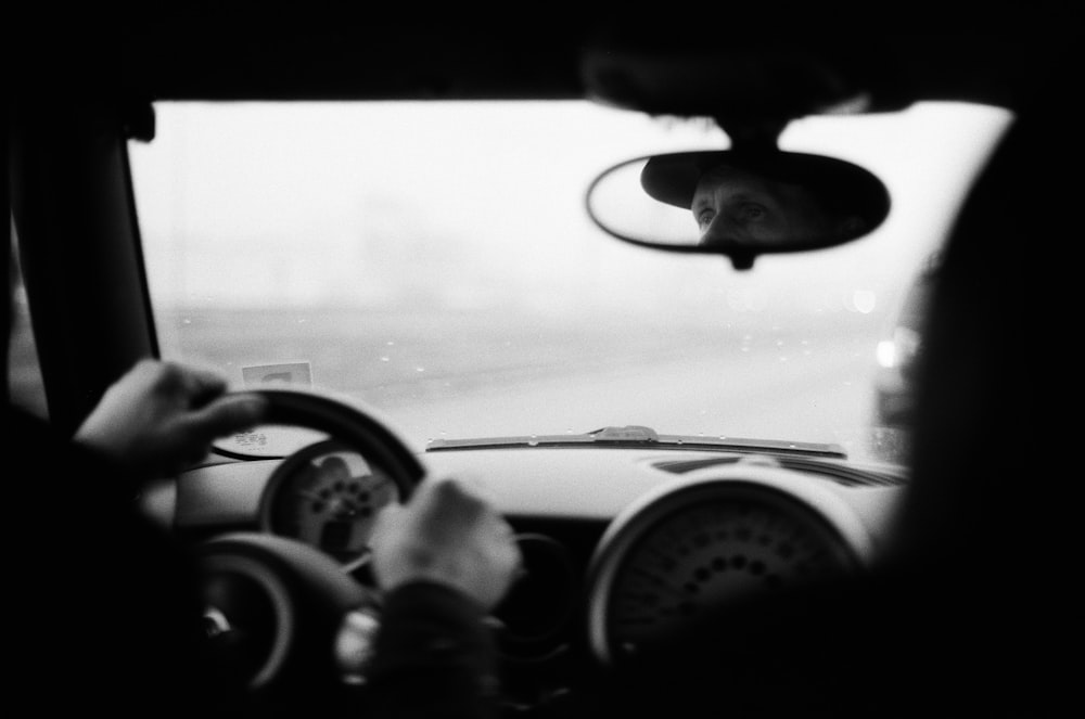 grayscale photo of a car interior