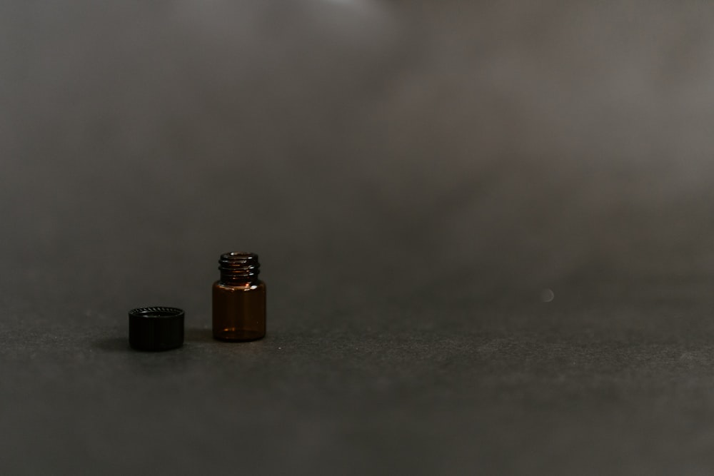 a bottle of essential oils sitting on a table