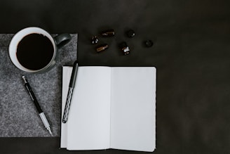 flat lay photo of coffee mug and pencils