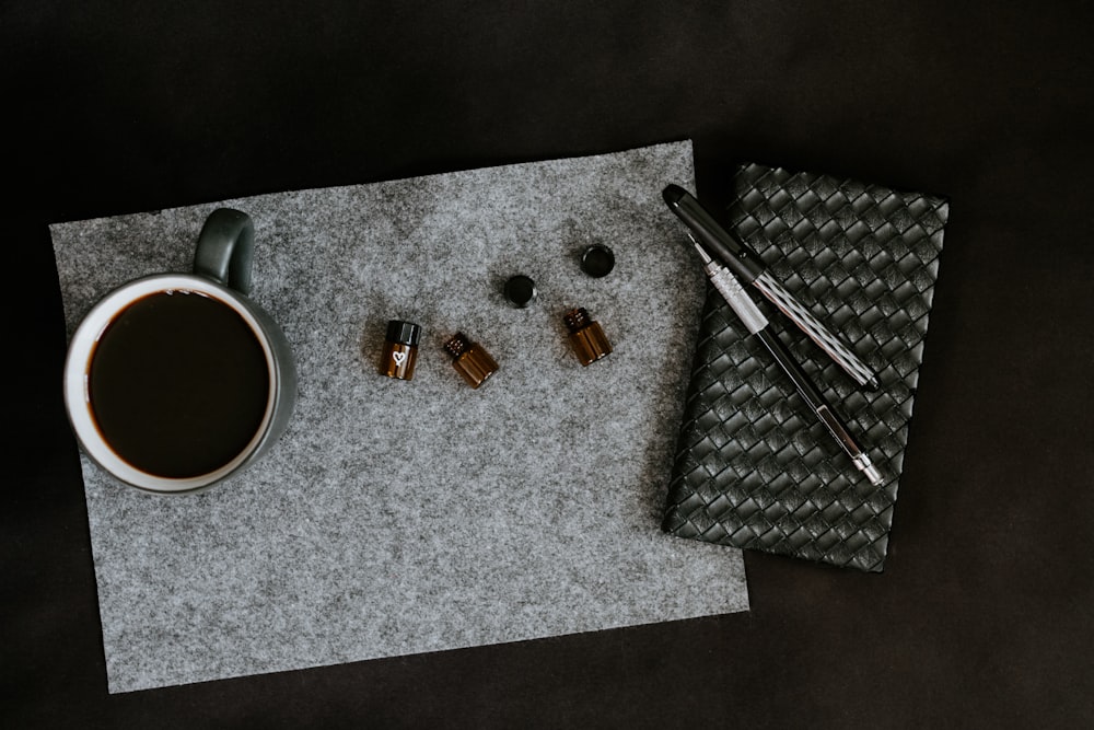 green cup on gray mat