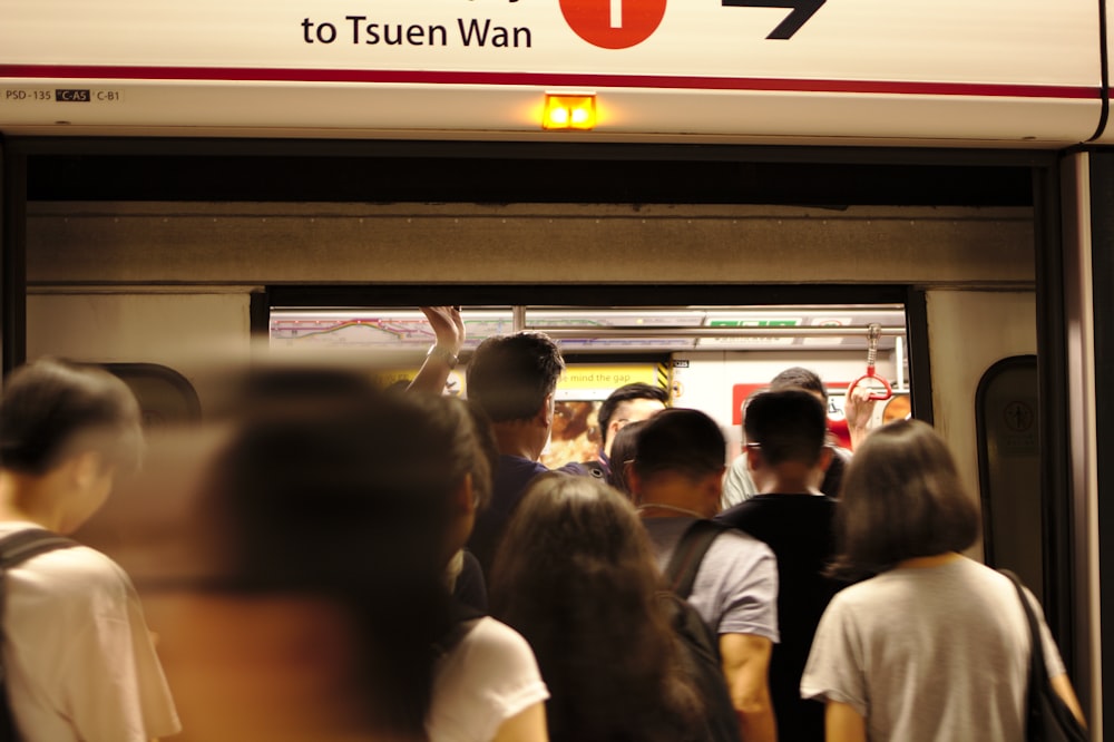 people entering a door close-up photography