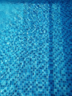 Close-up of clean pool water reflecting sunlight.