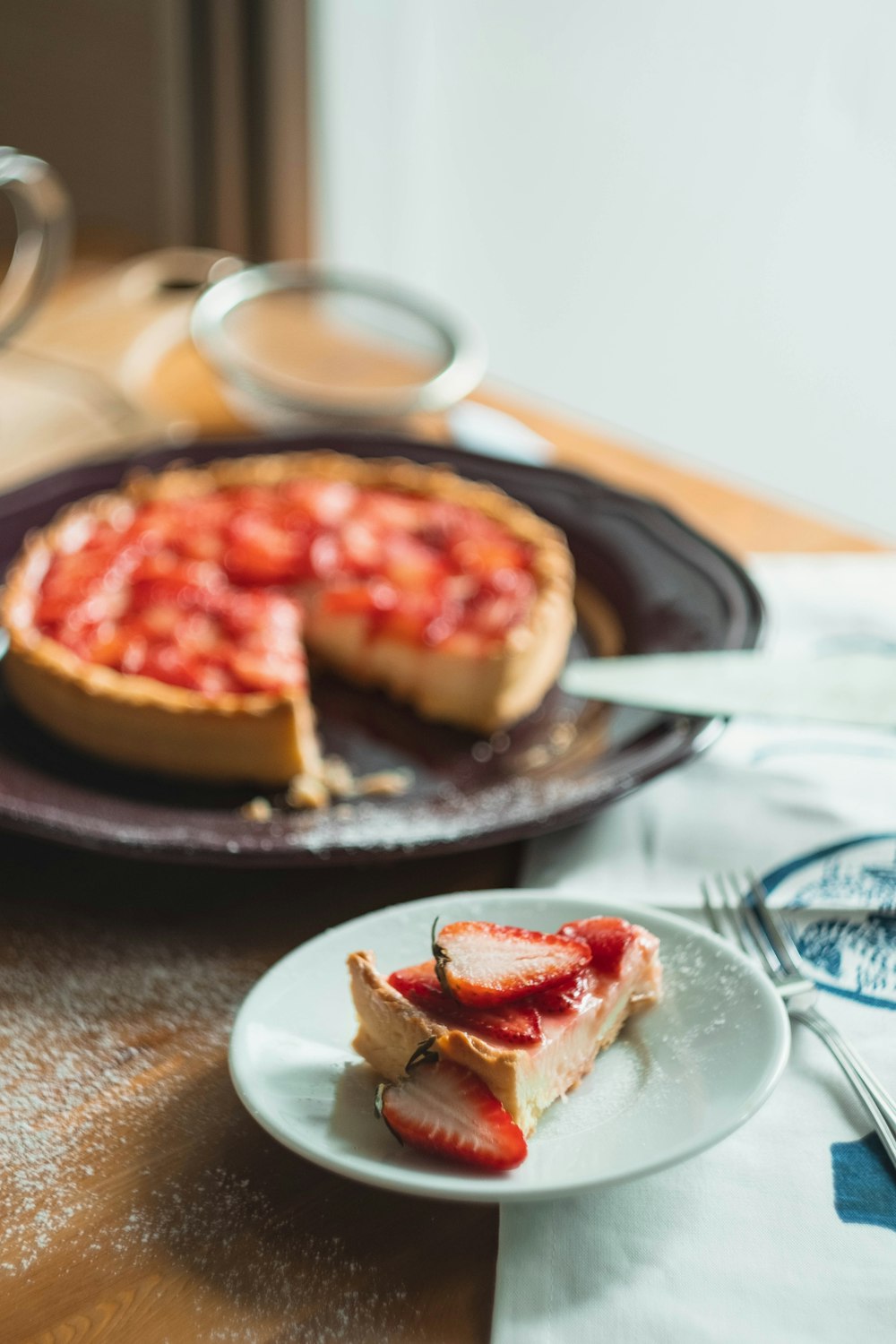 a slice of strawberry pie on a plate
