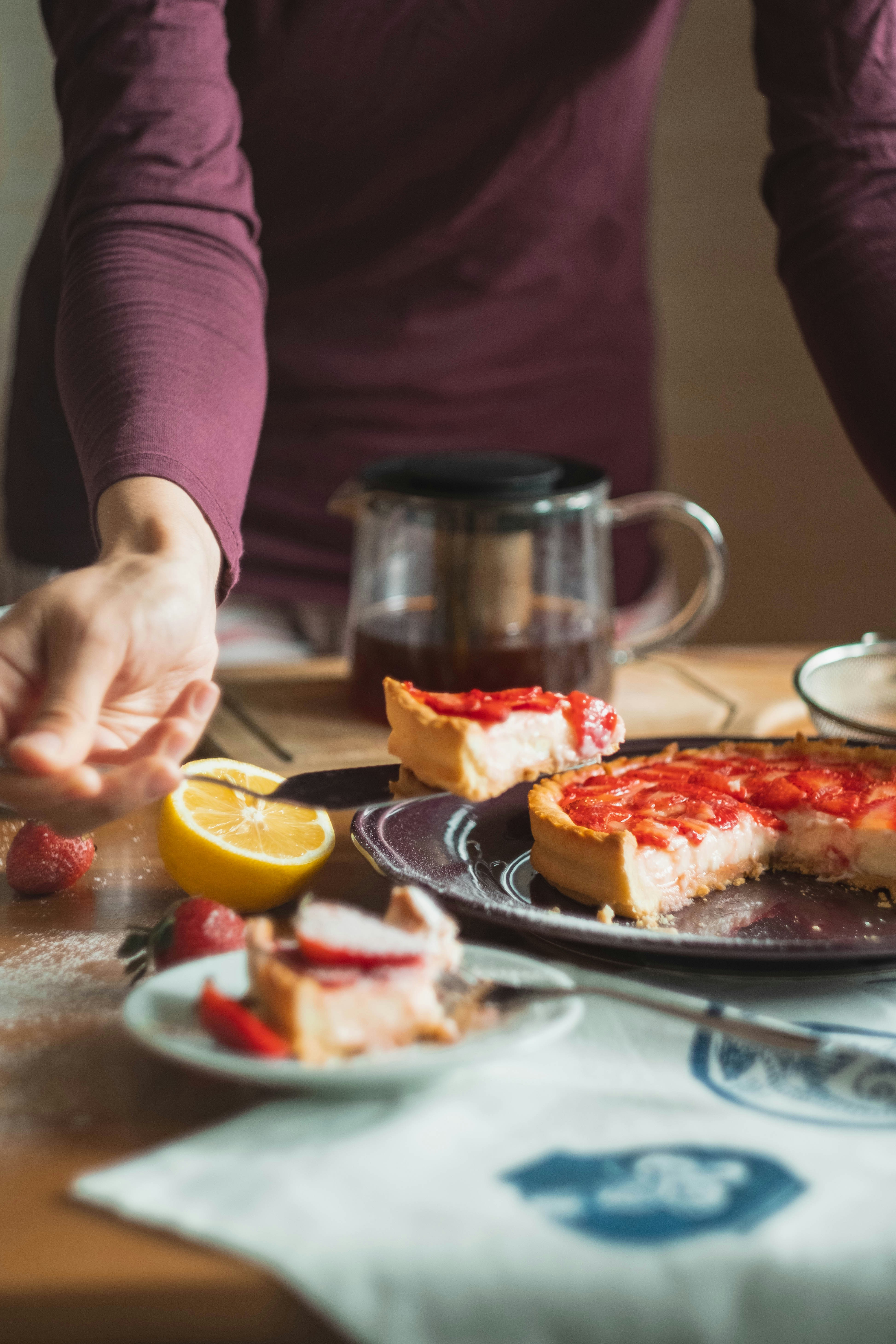 A vibrant strawberry tart with fresh berries on top.