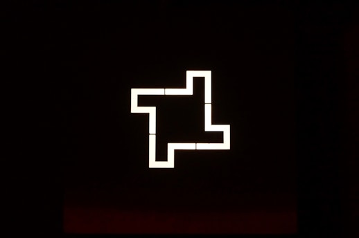 Minimalist graphic showing a clear path emerging from a complex maze.