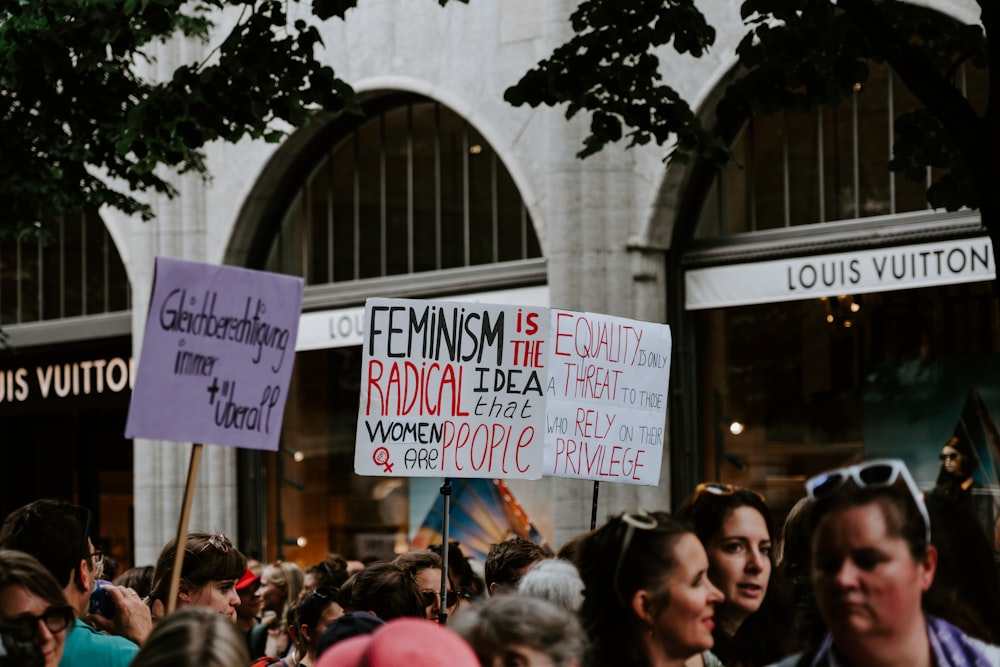 people rallying on road near buildings