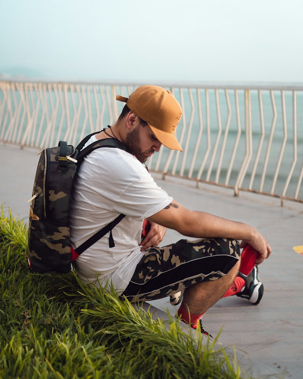 man sitting on grass