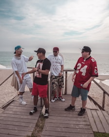 A small group engaged in a lively debate workshop by the beach.