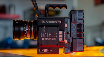 black Red Raven video camera on yellow surface