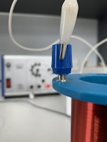 Copper coils energized on a sleek Quantum Light device, ready for use.