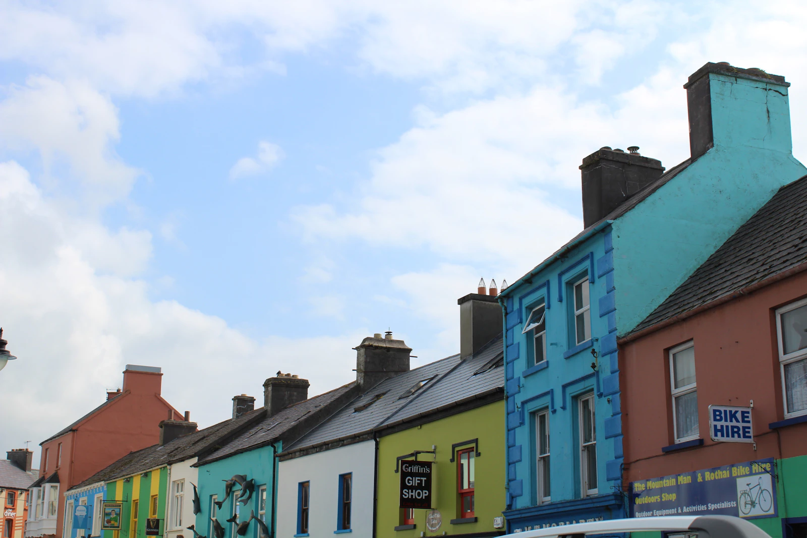 Row of colorful beach huts along the shoreline