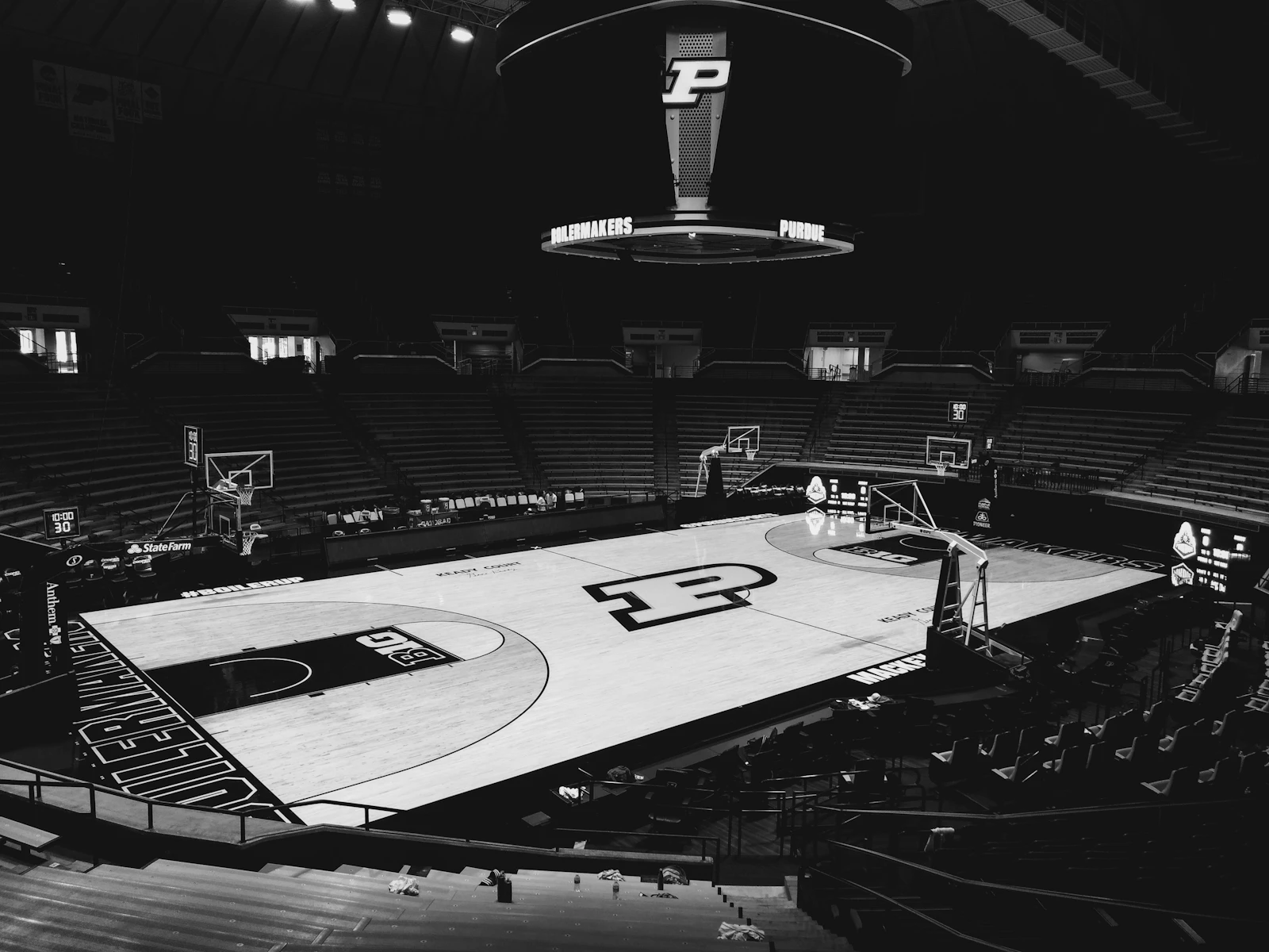 Empty basketball arena viewed from elevated seating, no players present.
