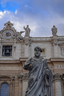 man holding weapon statue
