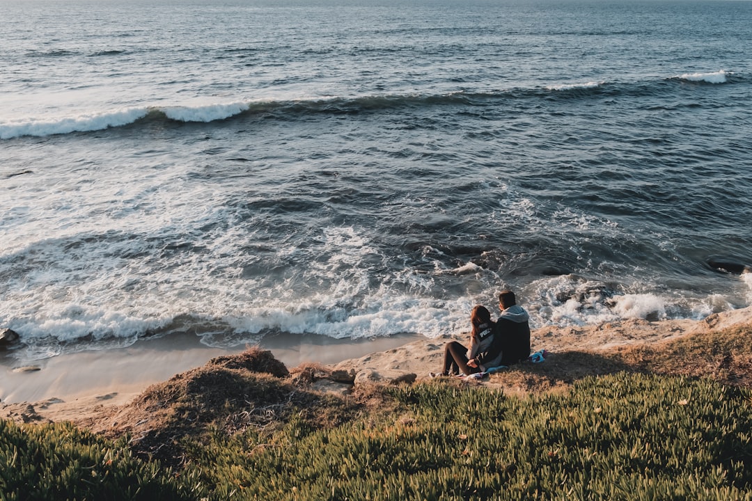 a man and a woman at a beach