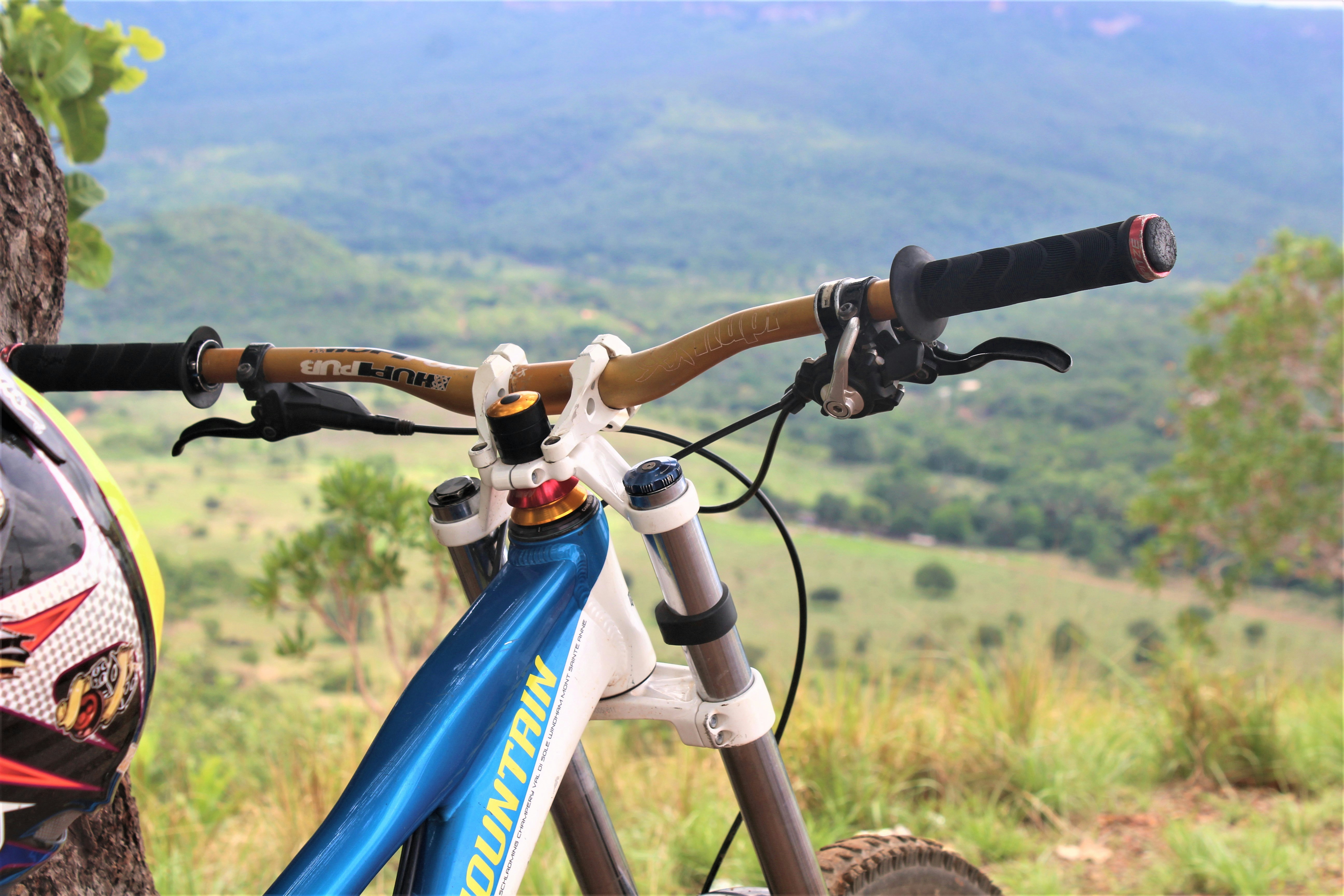 shallow focus photo of blue and white hardtail bike